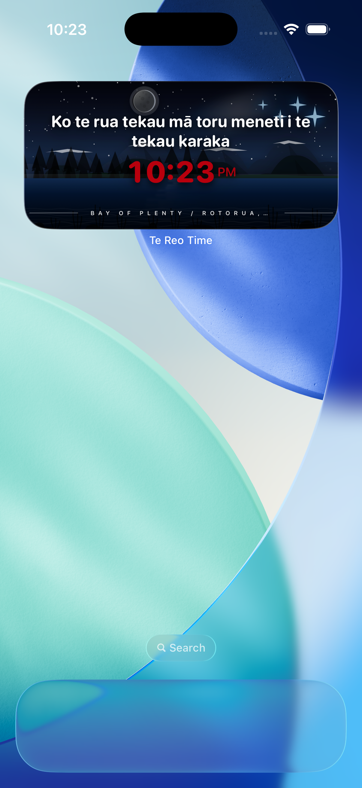 Te Reo Time widget at night showing time in te reo Māori with starry sky and forest landscape